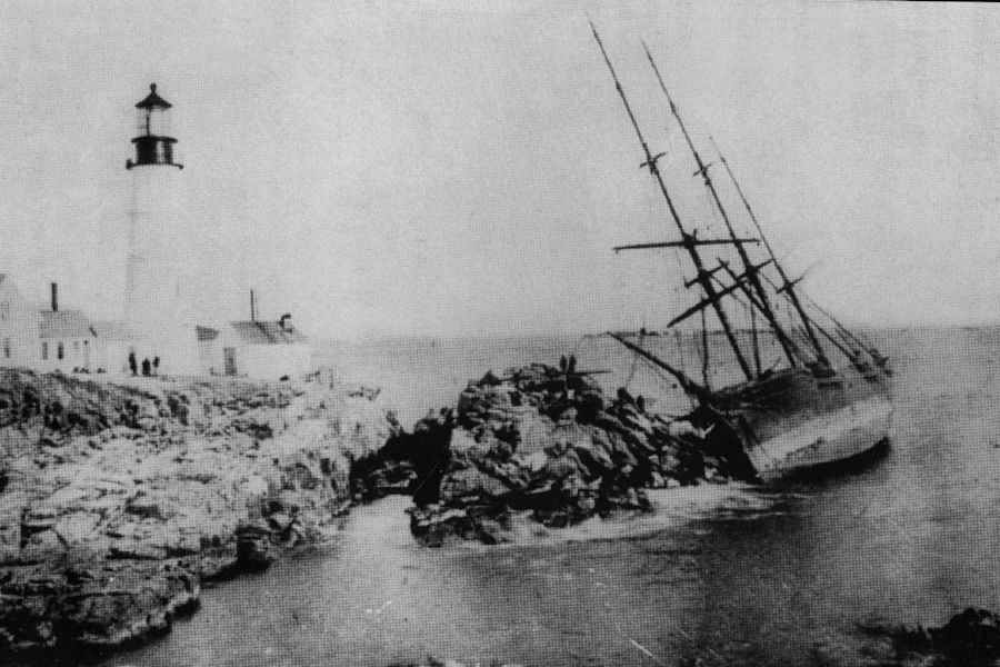 The Bark Anne C. Maguire wrecked at Portland Head Light, ME,  on Christmas Eve, 1886.