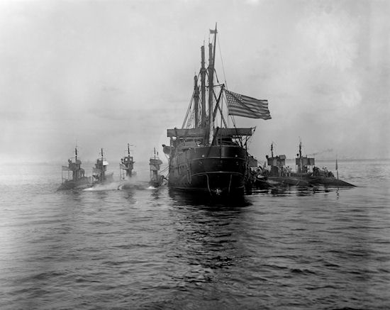 Stern view of seven submarines with their Tender USS Severn, New York Harbor, circa 1910, from Detroit Publishing Co., Photo # 022680; note the Severn was formerly the Training Ship USS Chesapeake, built at Bath Iron Works, Bath, Maine.